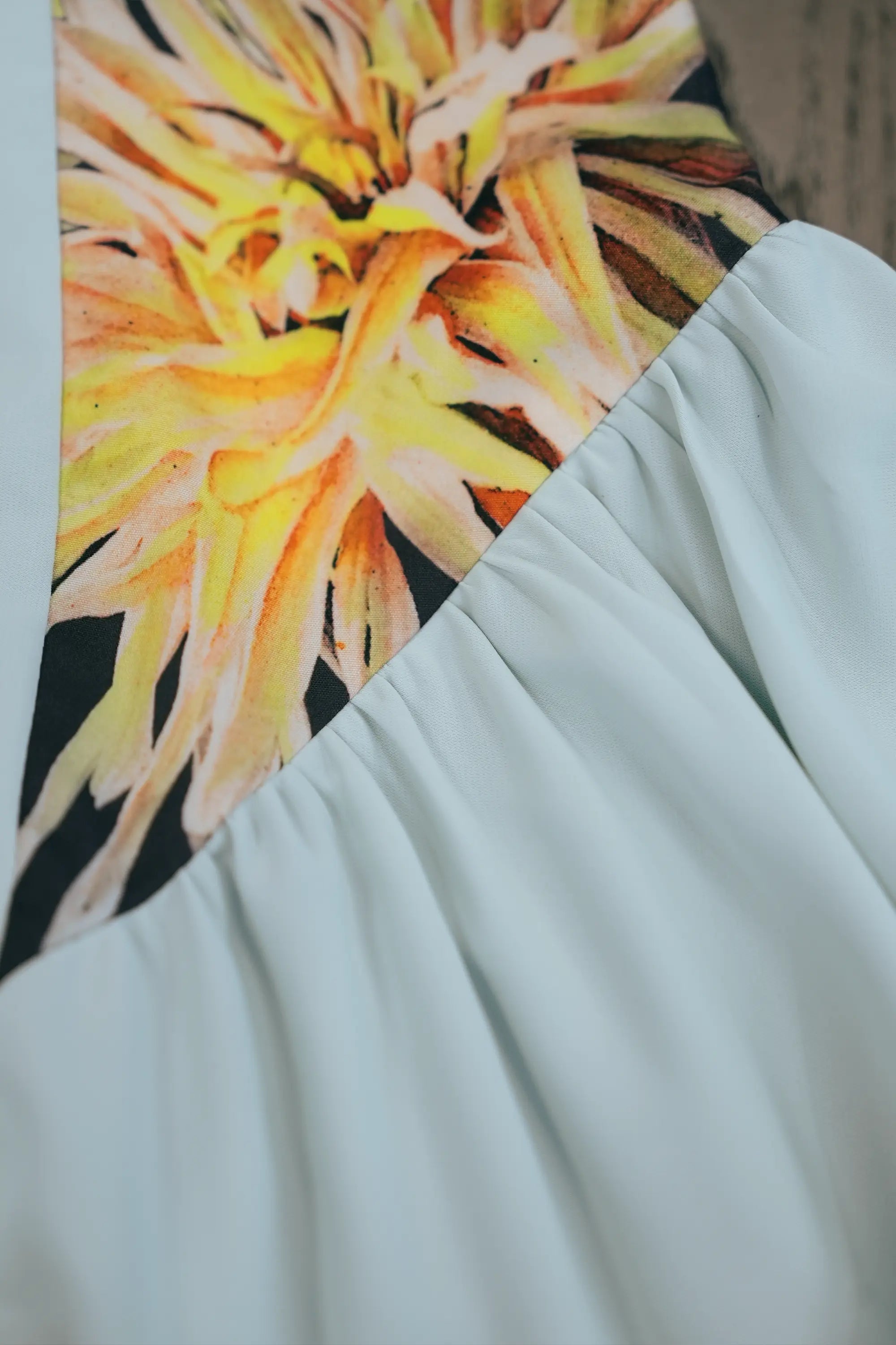 ABIDE contrast panel dress placement print and gathered skirt seam detail in light blue (close-up)