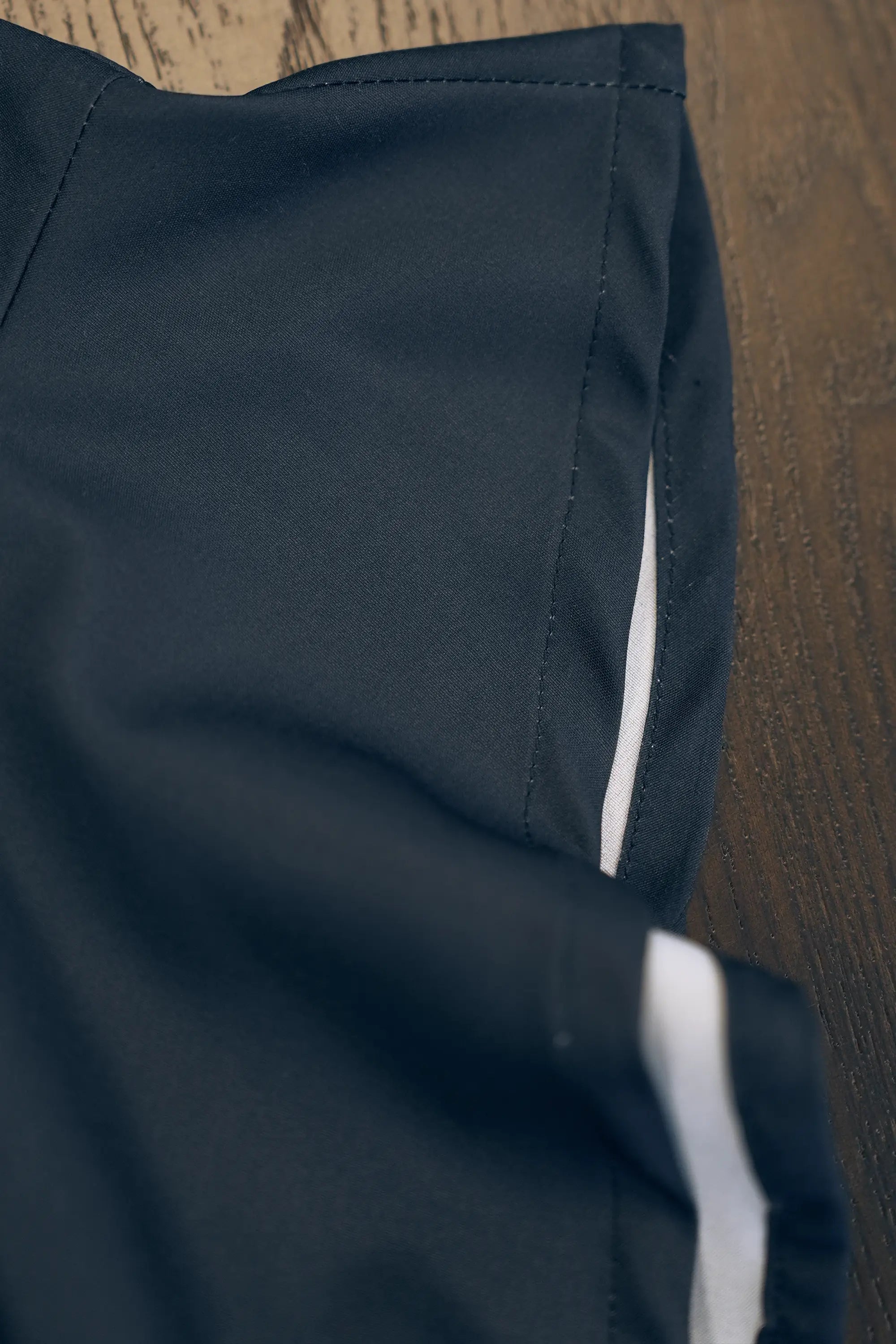 ABIDE contrast panel dress sleeve seam and inner contrast lining detail (close-up)