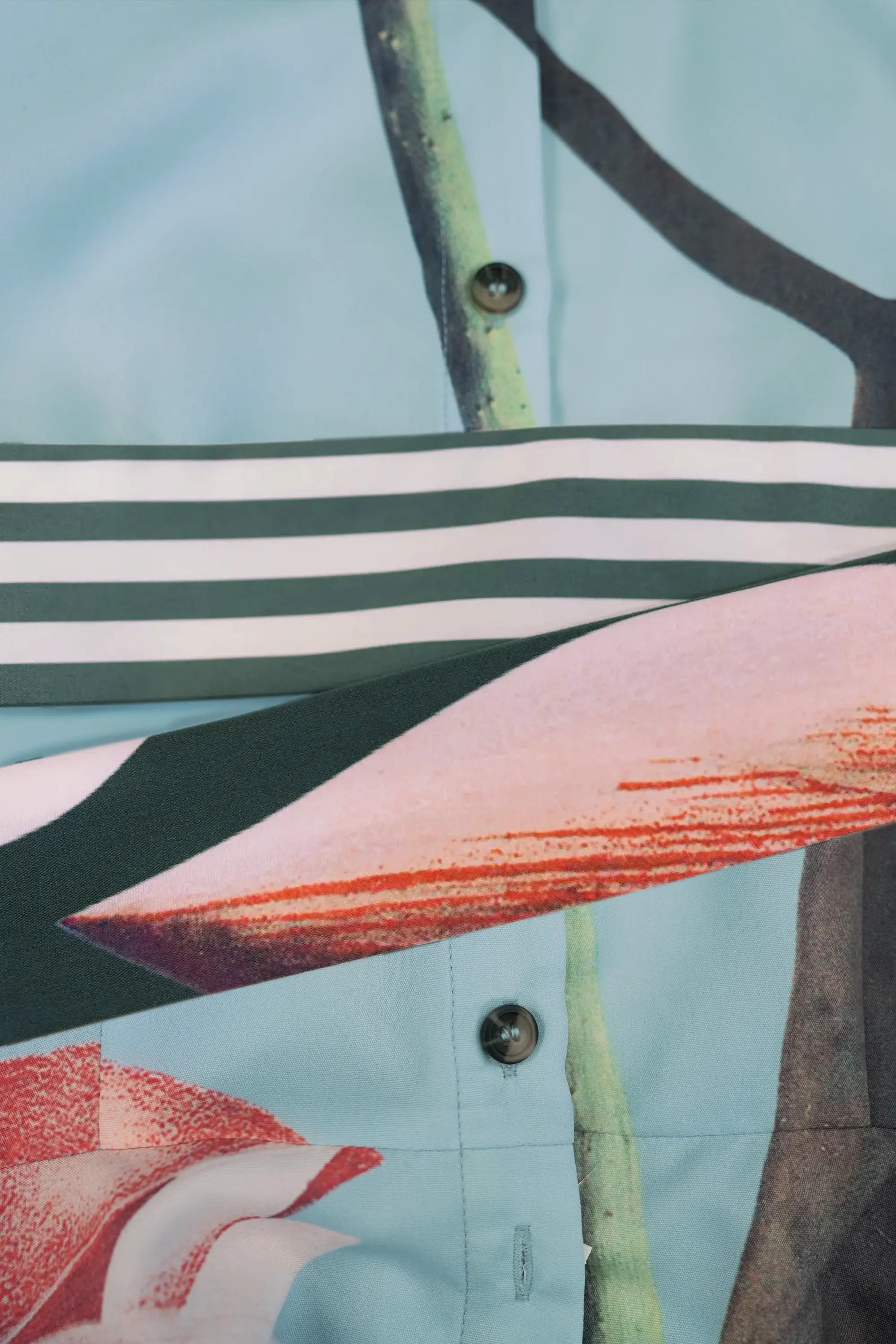 ABIDE placement print mini dress striped sash belt and button placket detail in light blue (close-up)