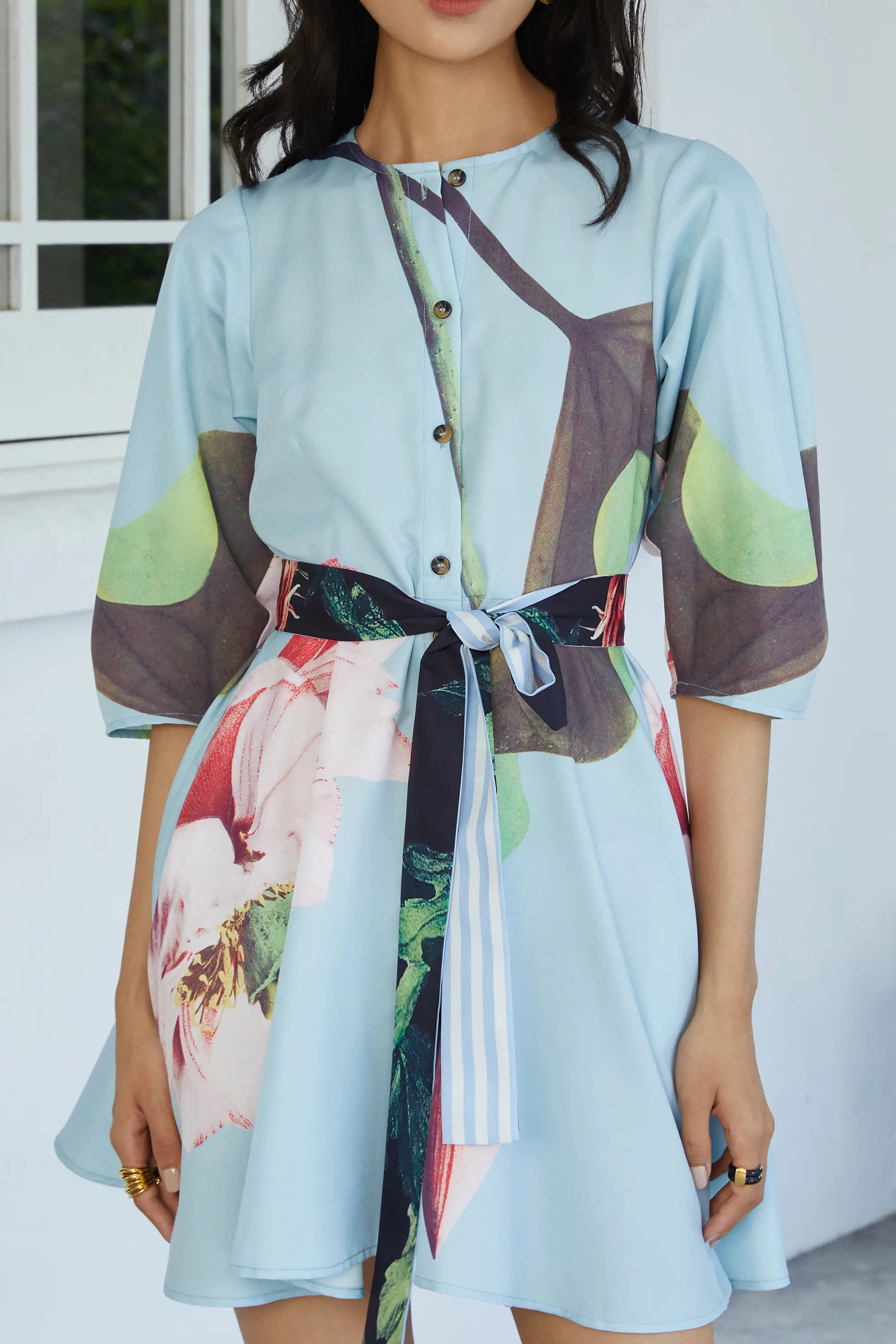 ABIDE placement print mini dress contrast sash belt and button front detail in light blue (close-up)