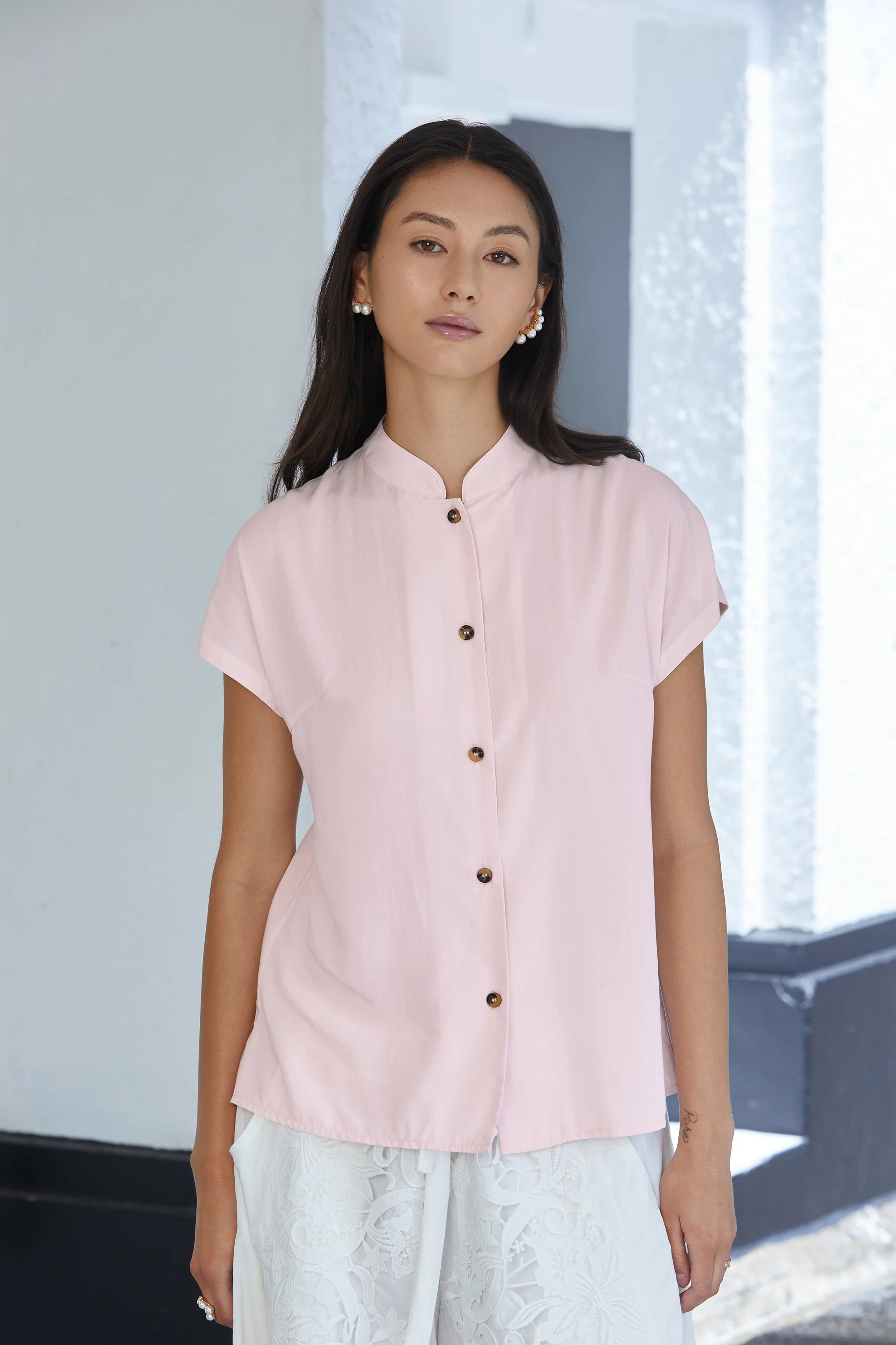 Front view of blush pink blouse with micro Chinese collar, short sleeves and button-down front