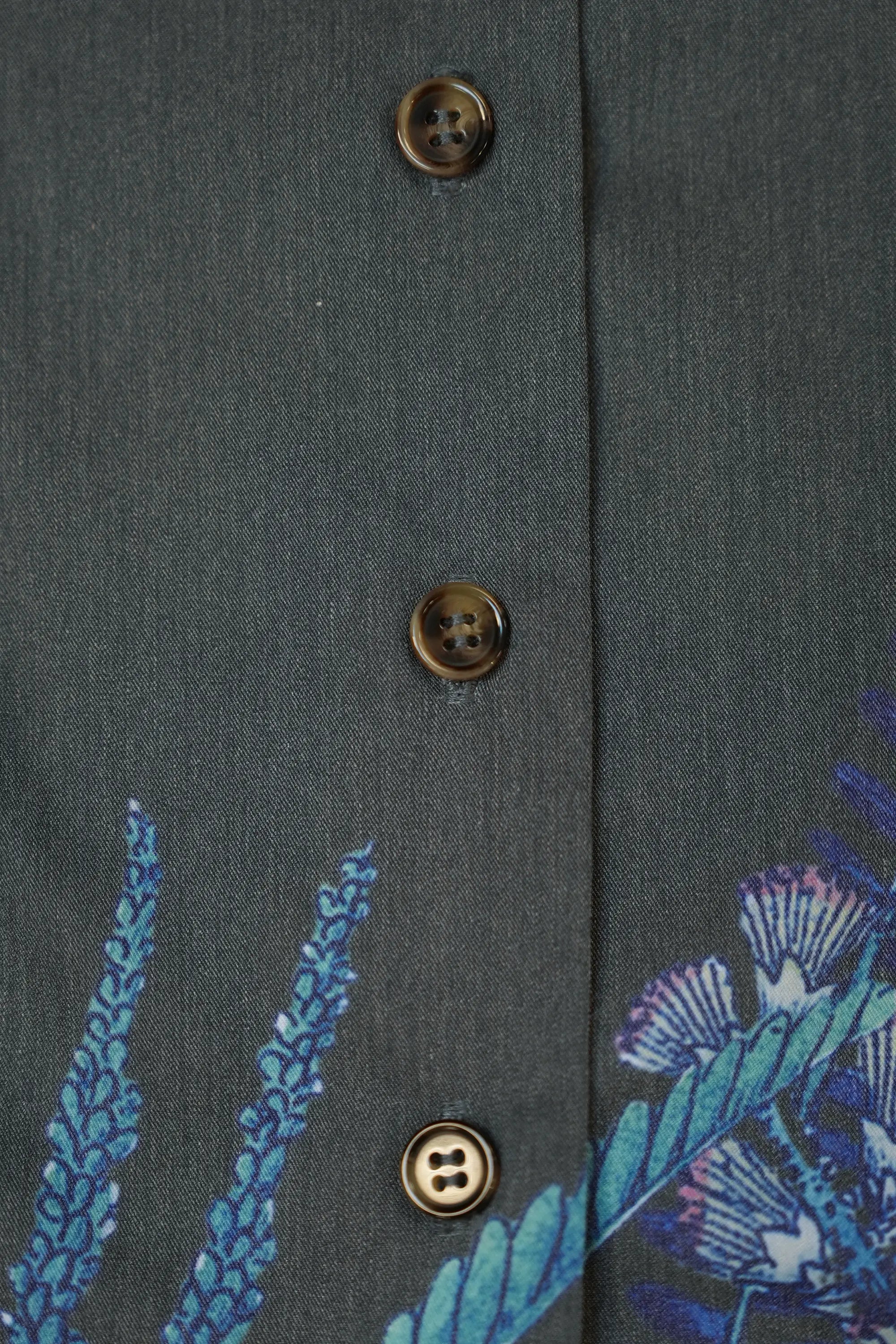 Close-up of front buttons on Arrayed Acacia Catechu fan contour top