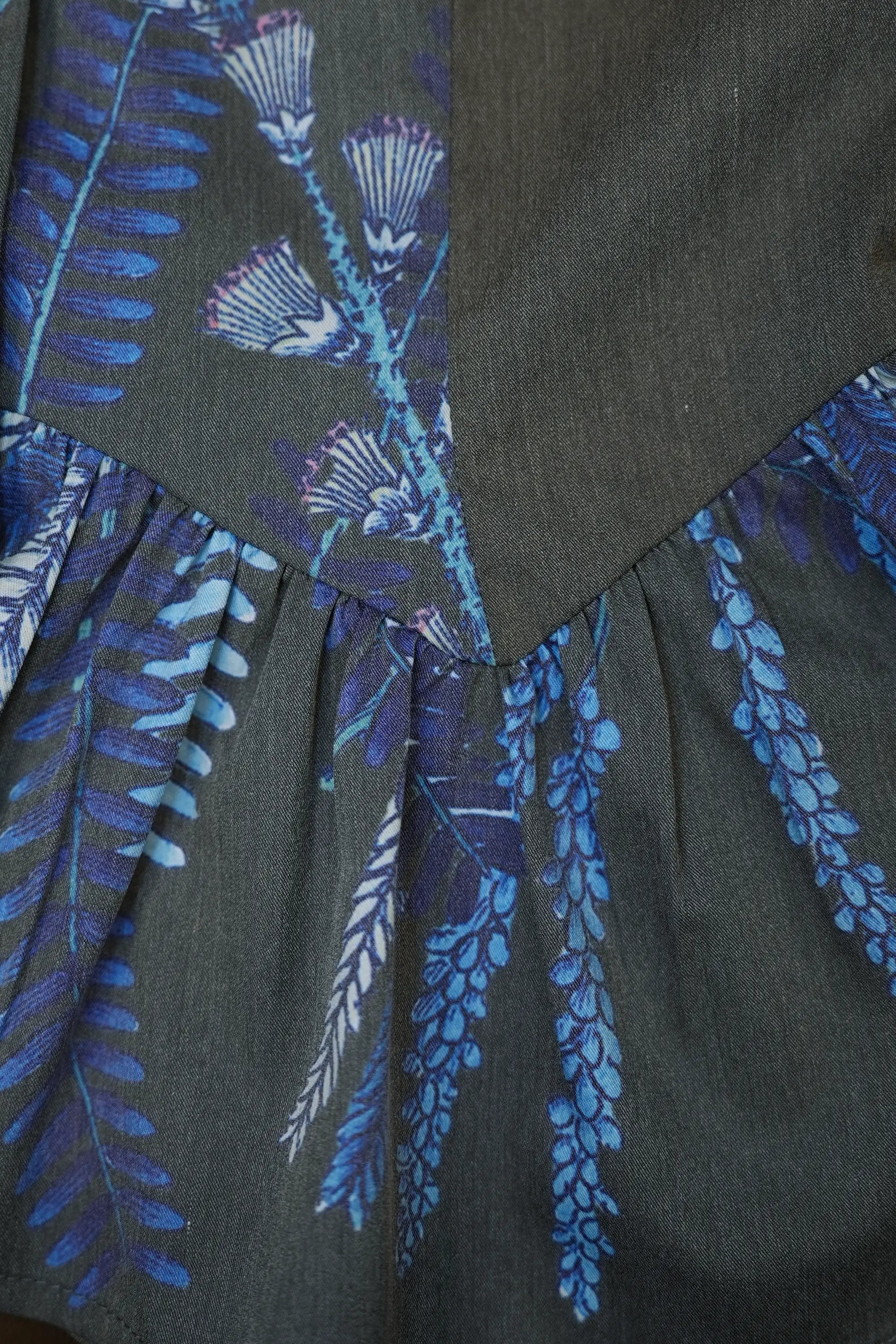 Close-up of gathered peplum waist on Arrayed Acacia Catechu top