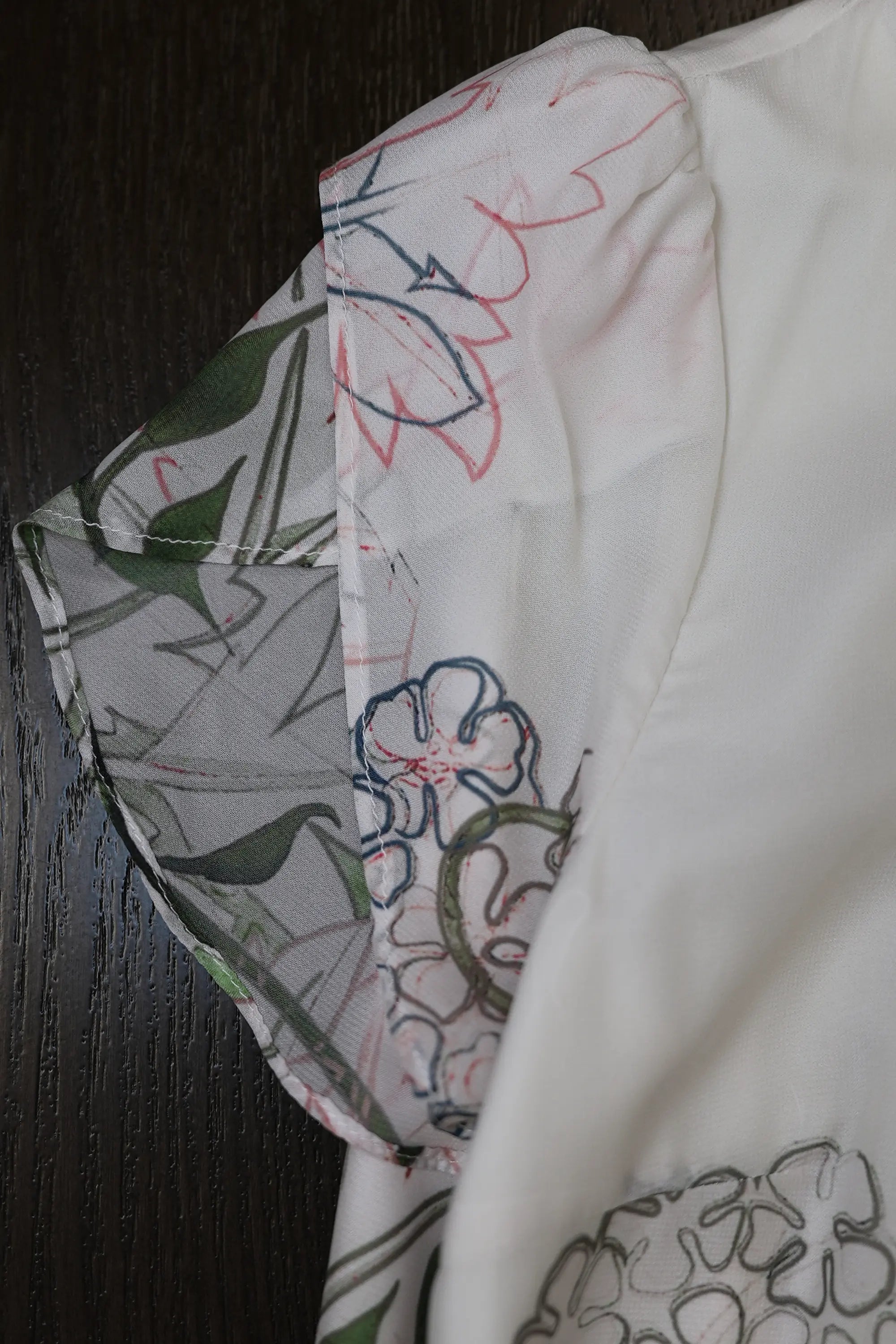 Close-up of petal sleeve on Arrayed Jasmine mermaid maxi dress