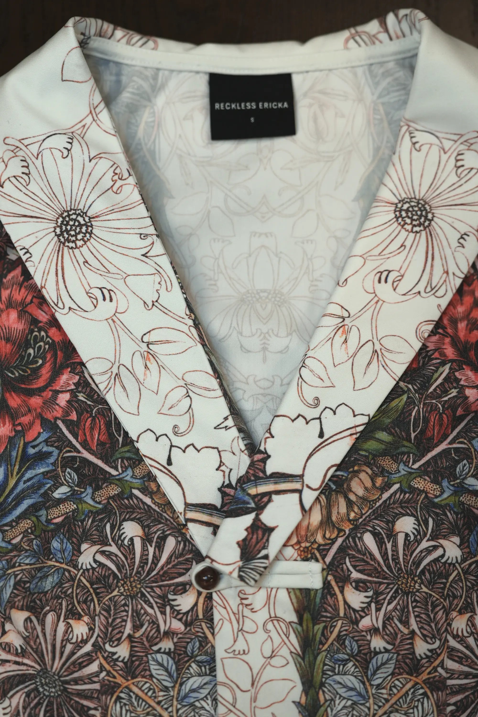 Close-up of shawl collar on Arrayed Honeysuckle vest top