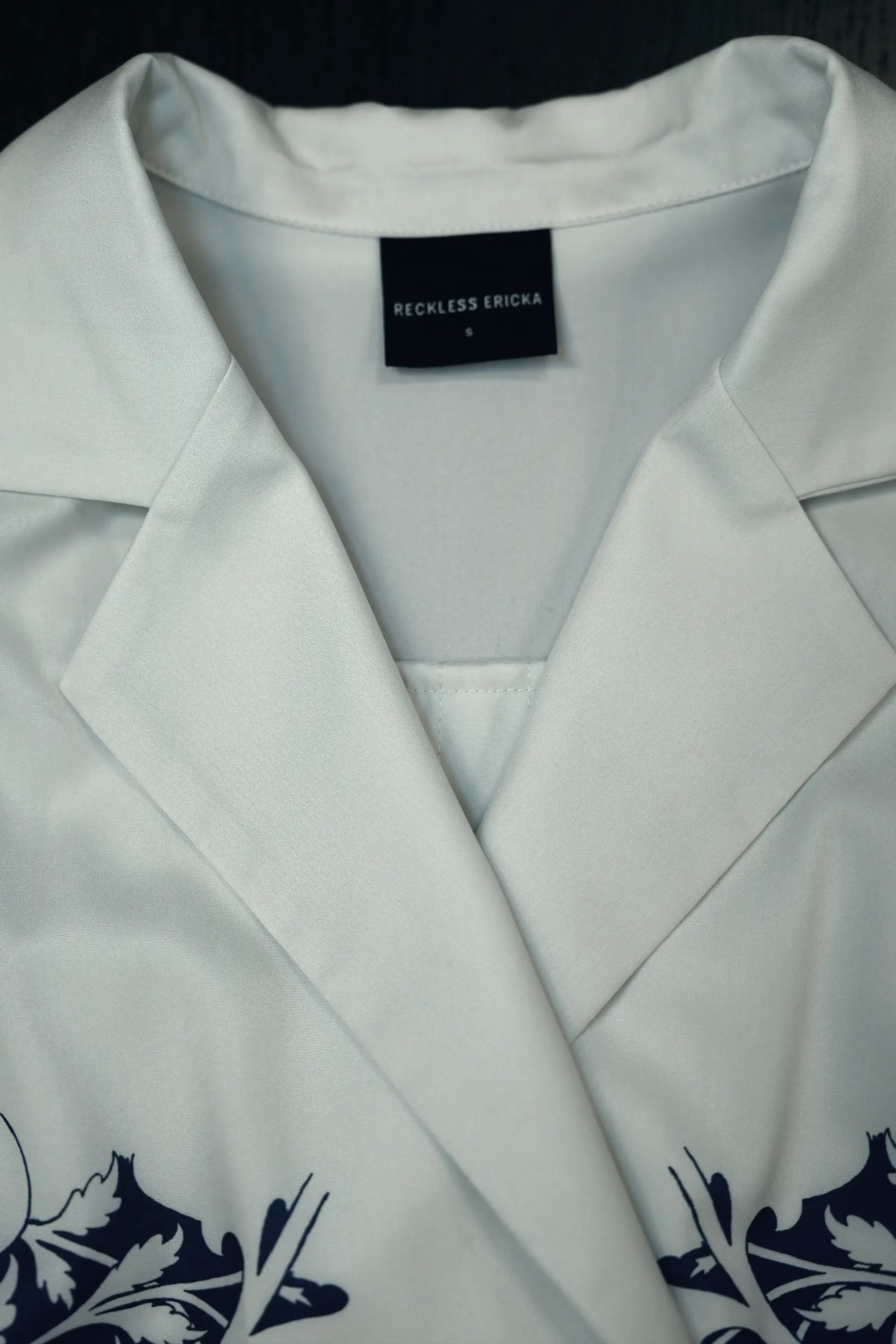 Close-up of notched lapel collar on Arrayed Peony trench dress