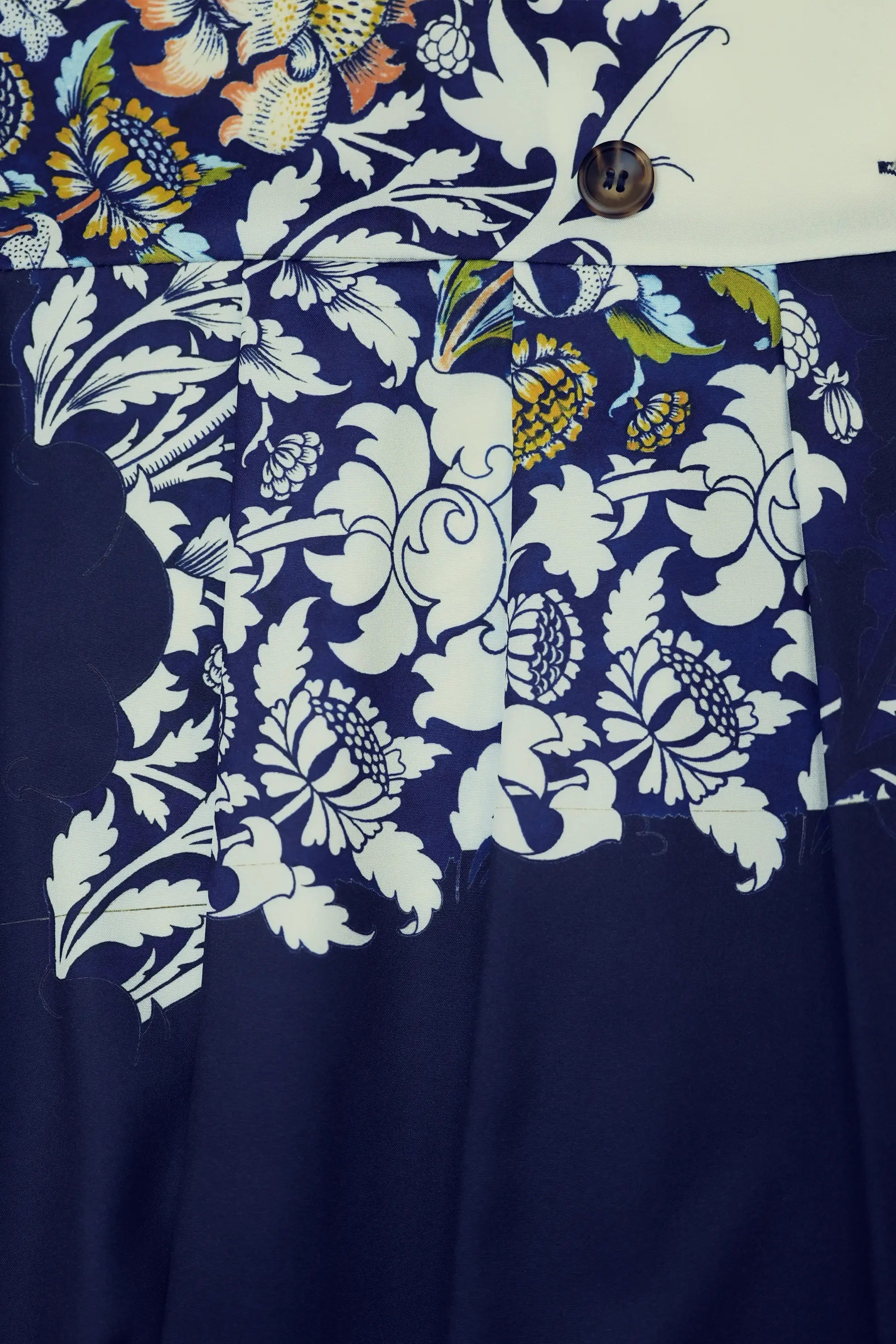 Close-up of back yoke box pleat on Arrayed Peony trench dress