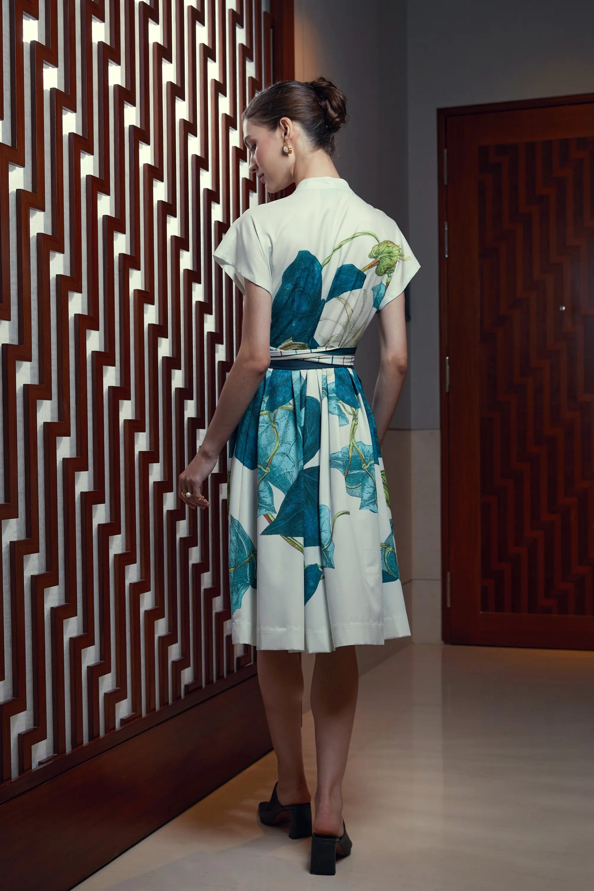 Woman wearing Arrayed Bindweed print Chinese collar knee dress in ivory, back view