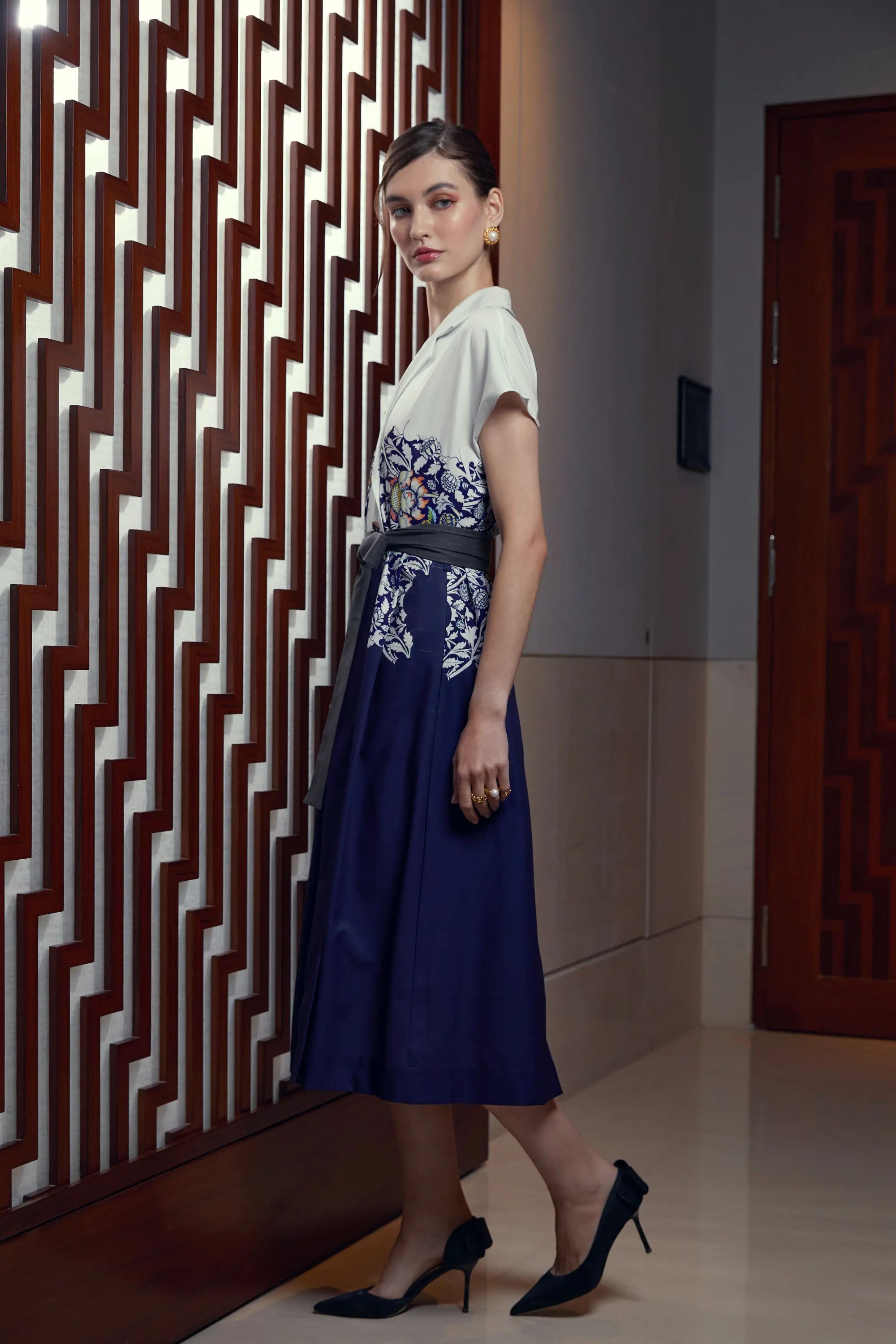 Woman wearing Arrayed Peony print trench midi dress, side view