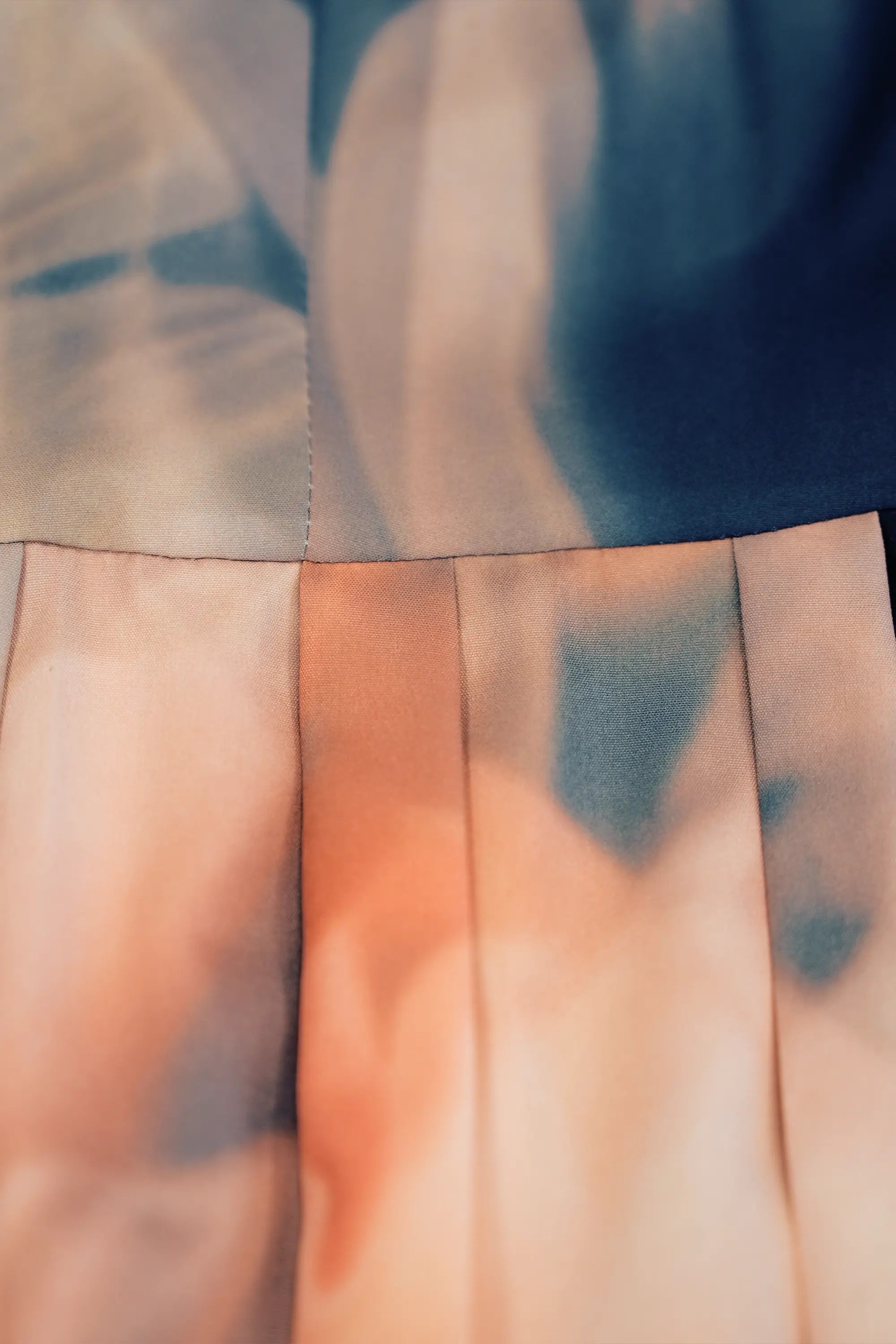 ABIDE placement print midi dress pleat detail (close-up)