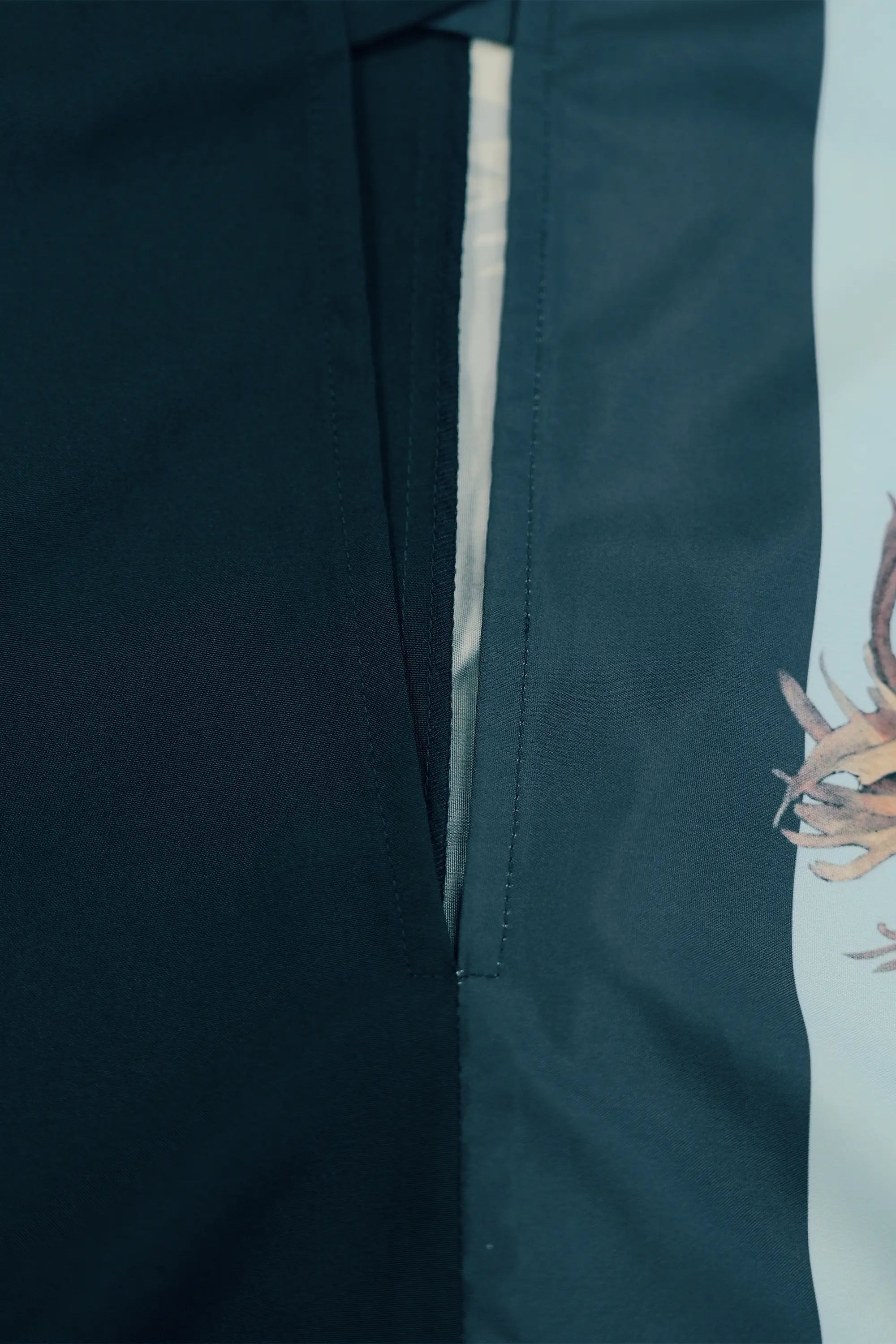 Close-up of concealed side pocket opening, neatly integrated into the seam for a clean, uninterrupted silhouette