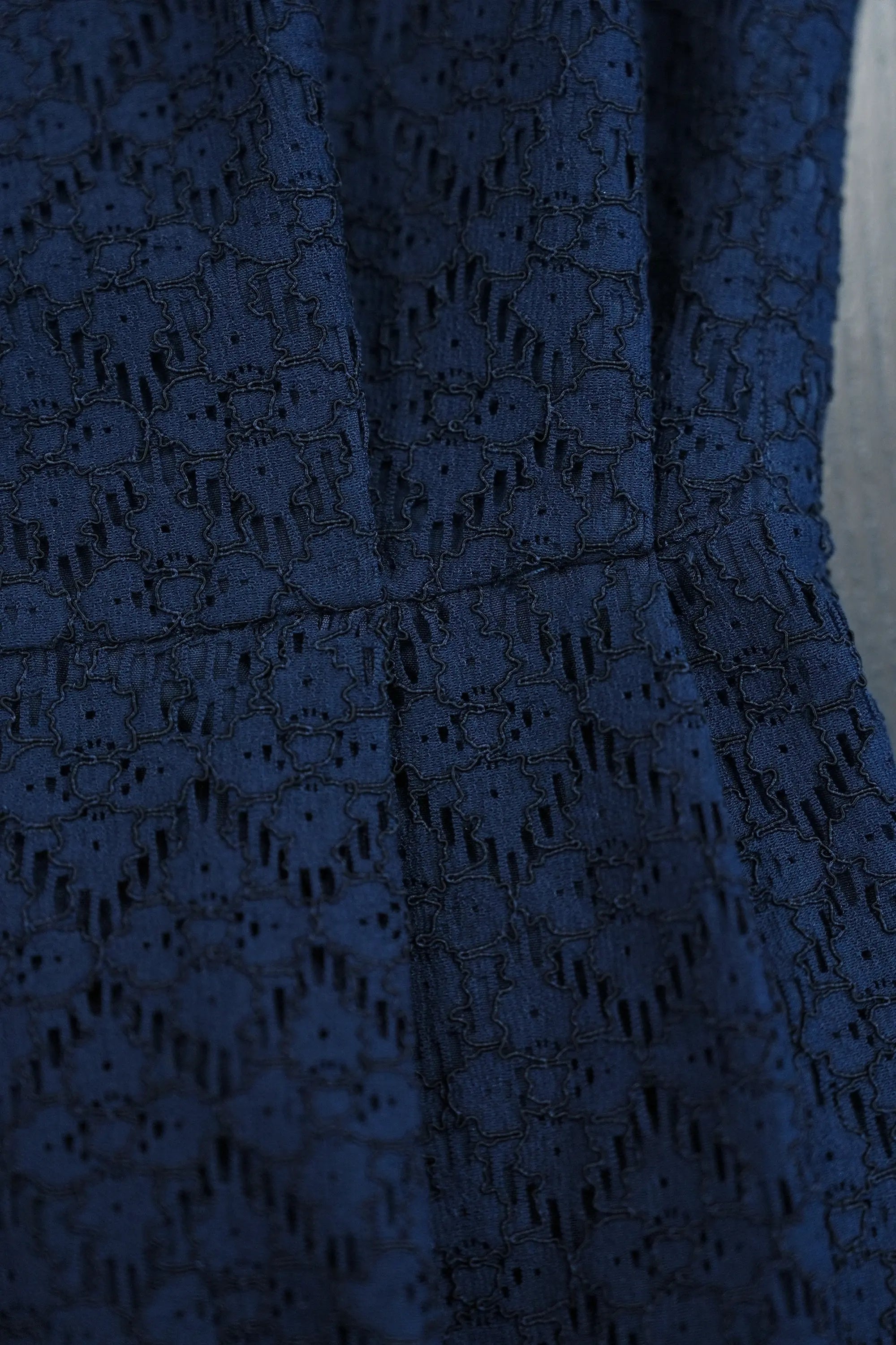 ABIDE navy lace fabric texture with intricate pattern detail (close-up)