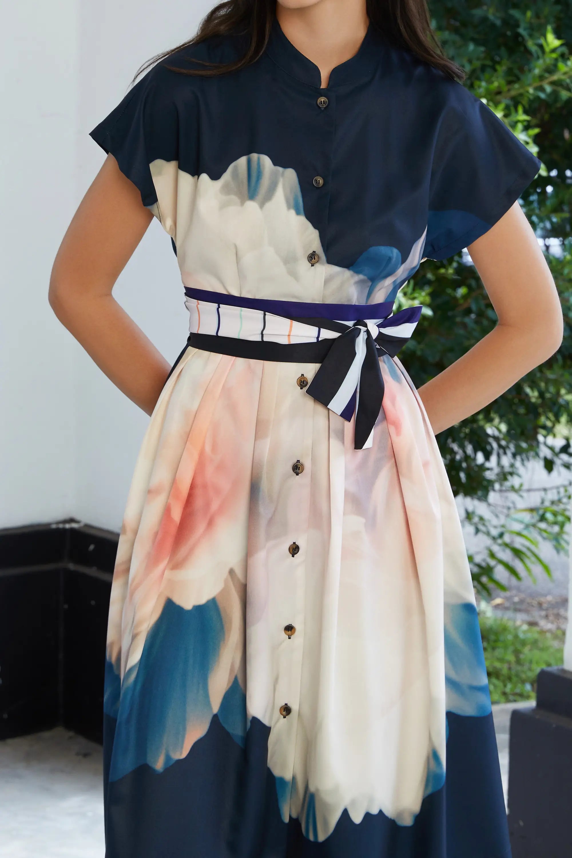 ABIDE placement print midi dress contrast sash belt and button front detail in navy (close-up)