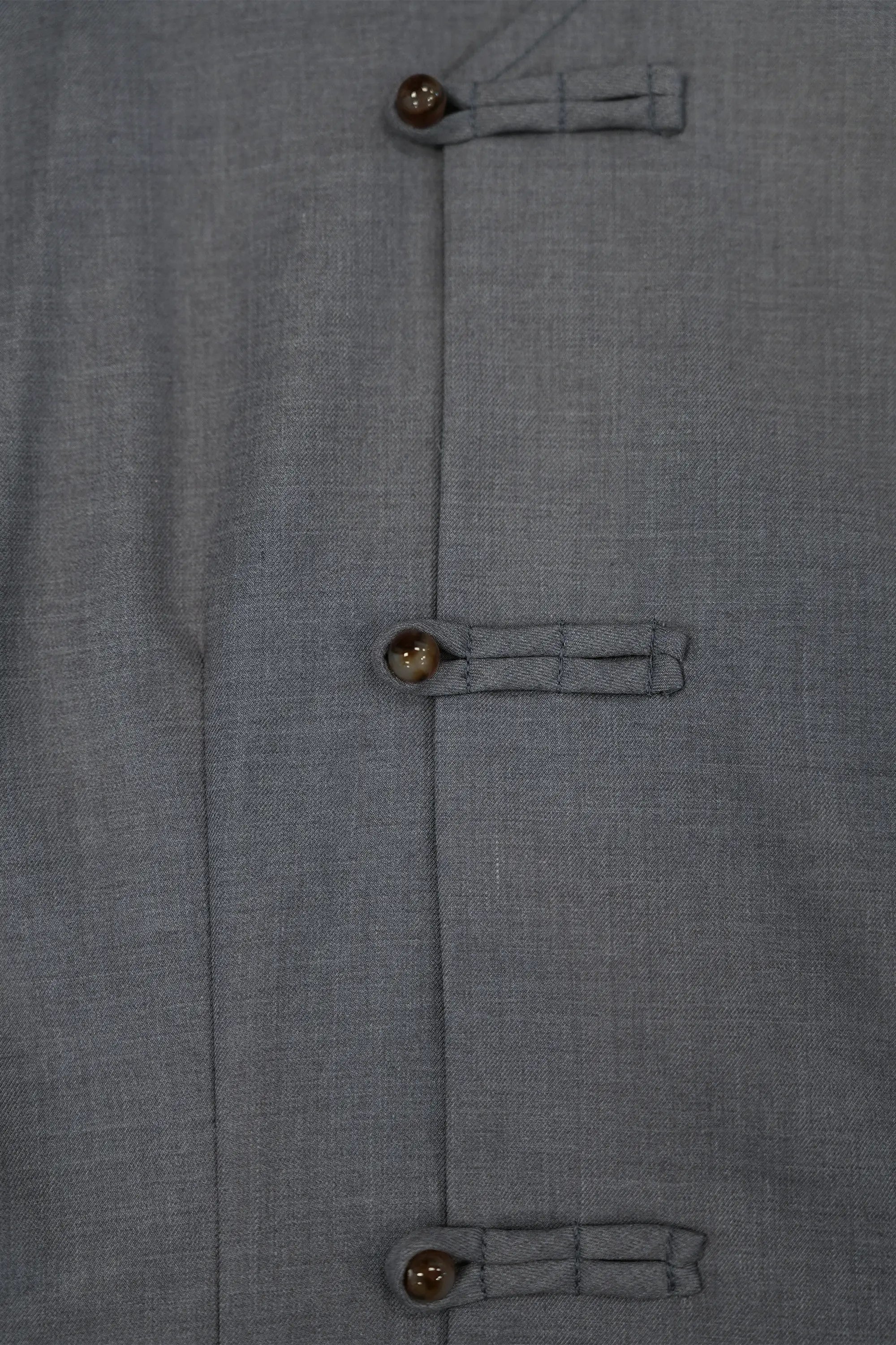 Close-up of pankou buttons on Arrayed grey Blue Carnation square sleeve top