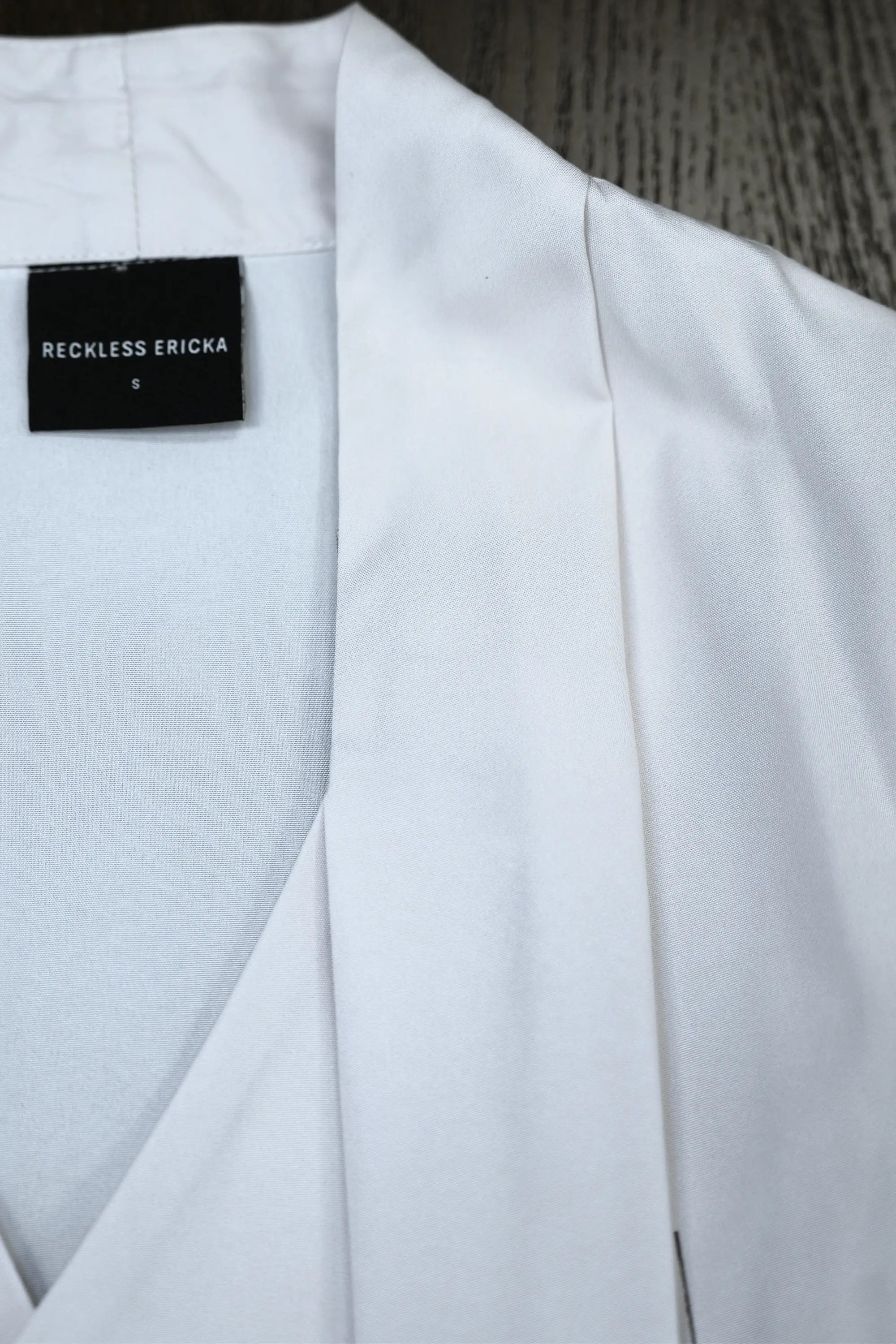 Close-up of blended wrap collar on Arrayed Peony calla sleeve dress