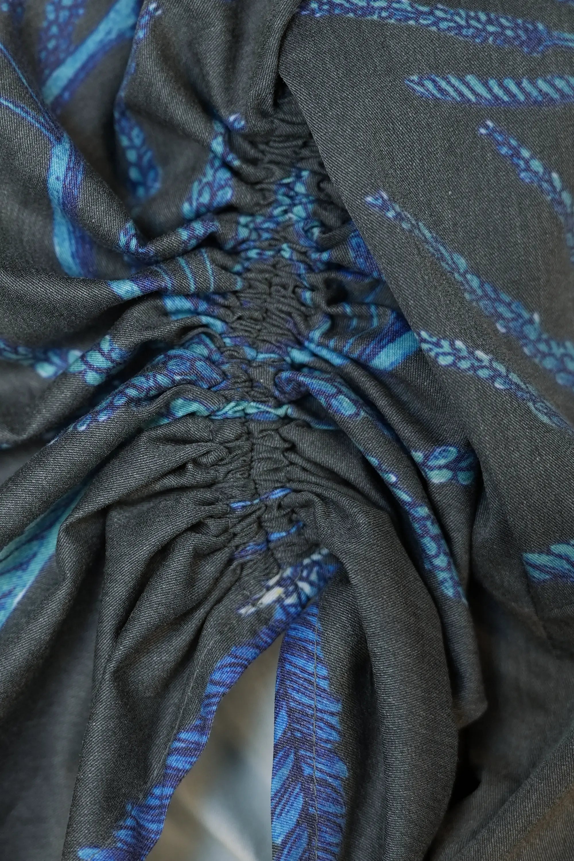 Close-up of drawstring on Arrayed Acacia Catechu fan contour top