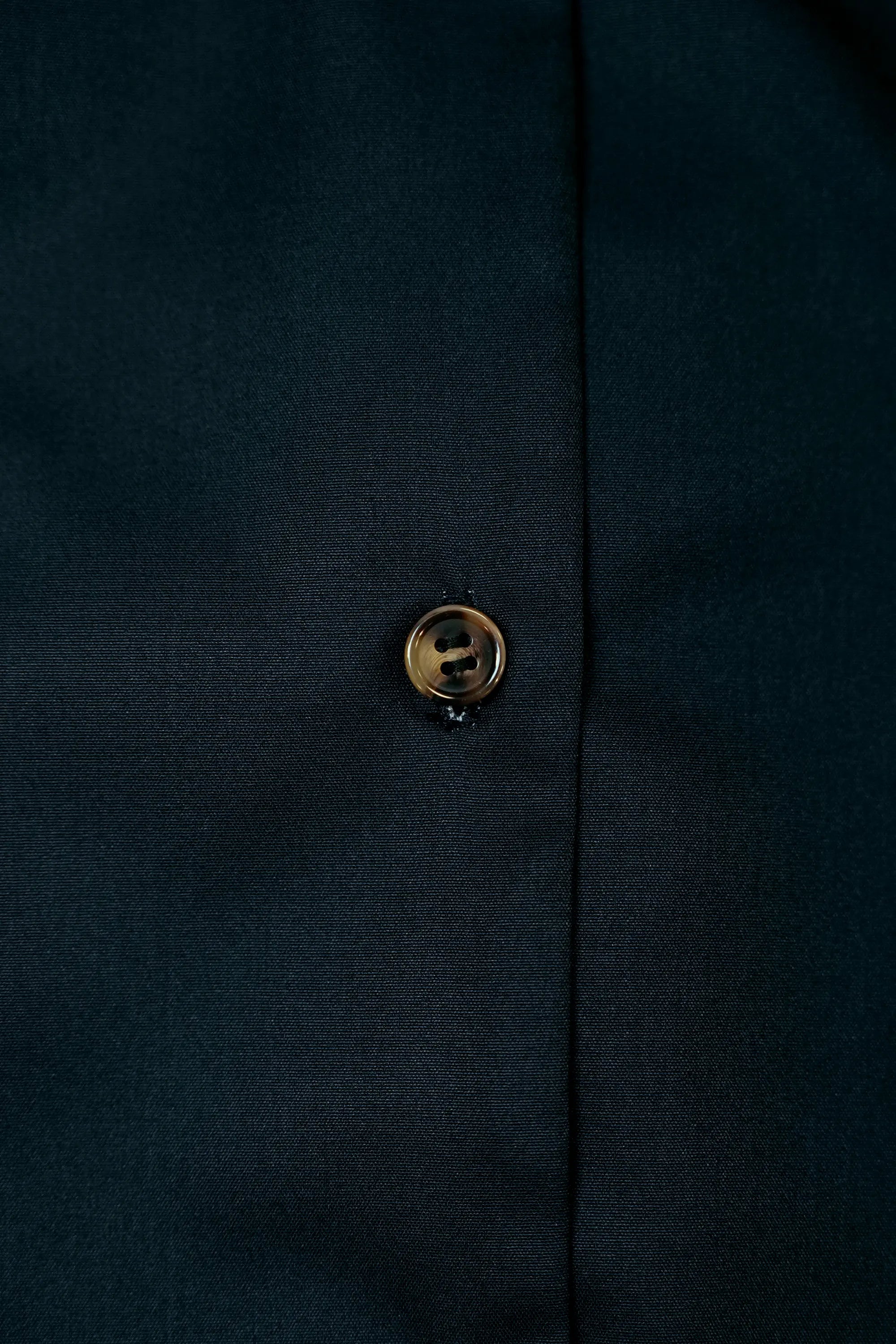 Close-up of front buttons on Arrayed Monk's Hood print shirt dress