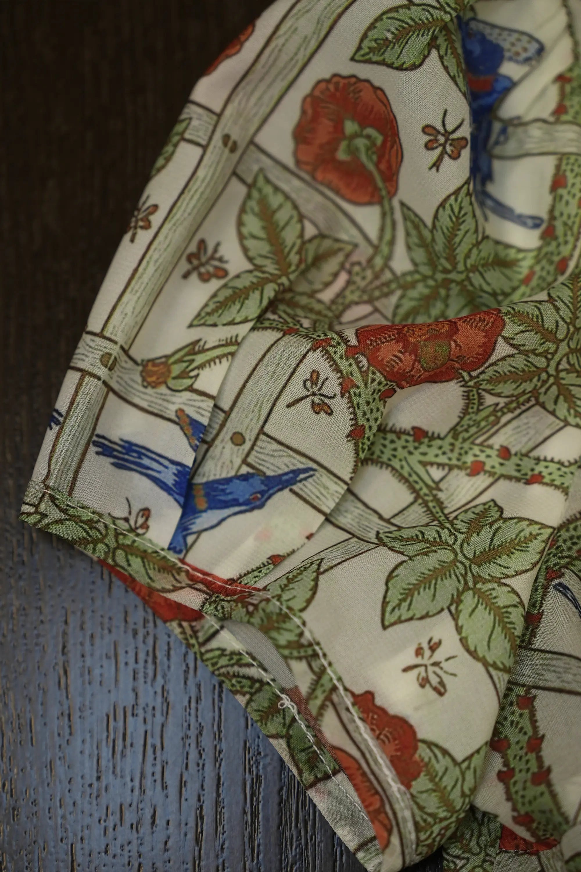 Close-up of puff sleeve on Arrayed Trellis-print keyhole peplum top
