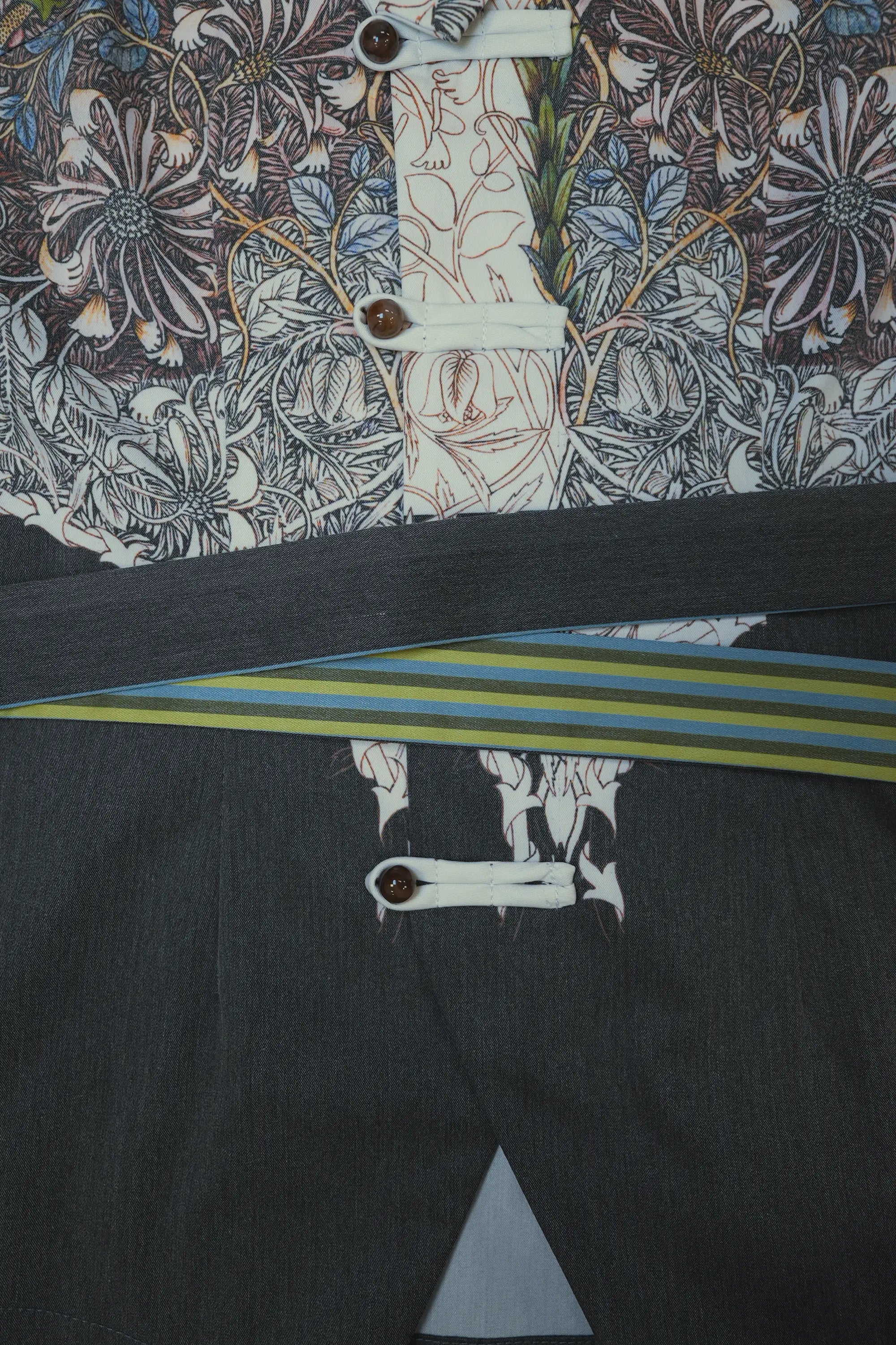 Close-up of detachable sash on Arrayed Honeysuckle shawl collar top