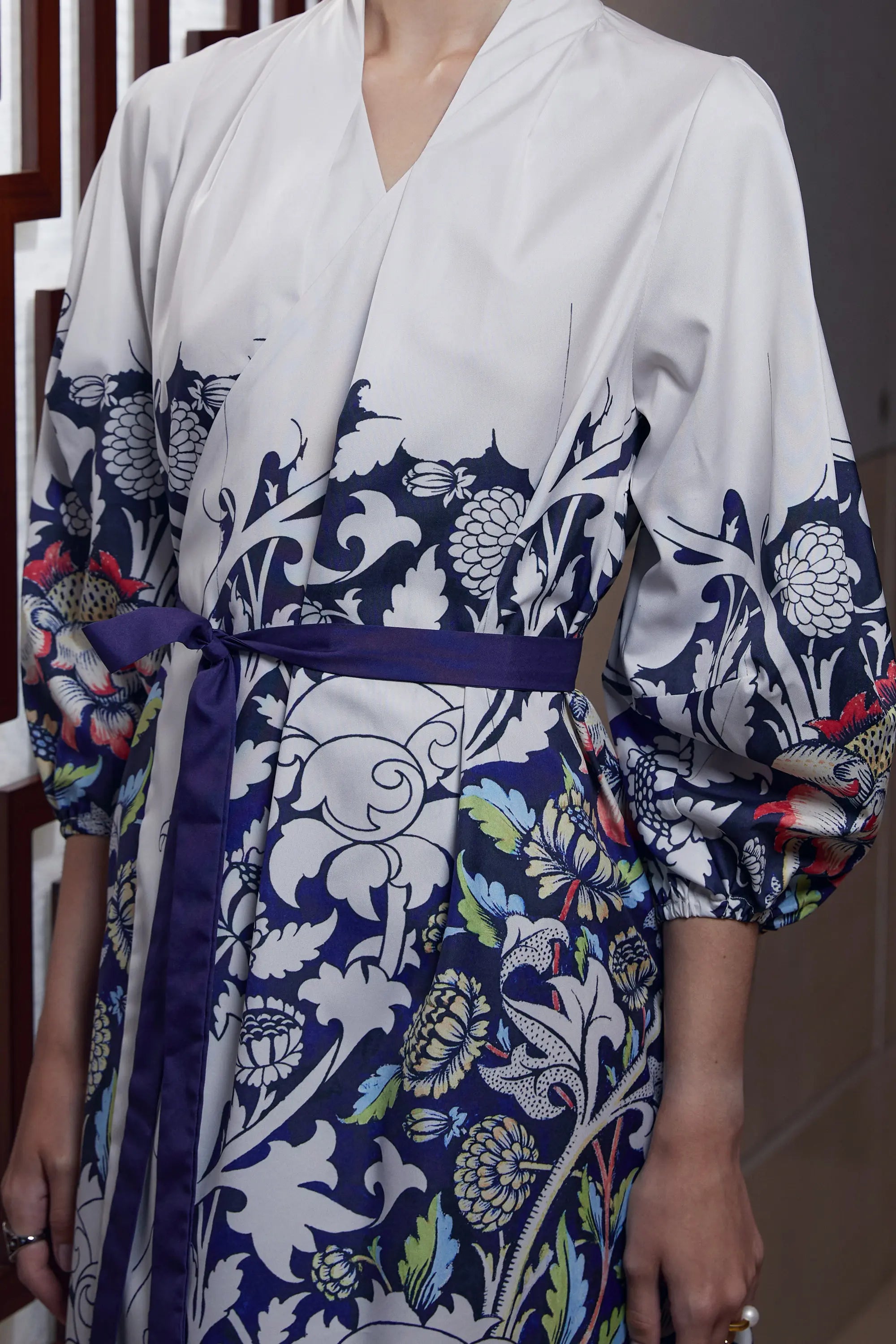 Arrayed Peony floral print detail on ivory wrap dress