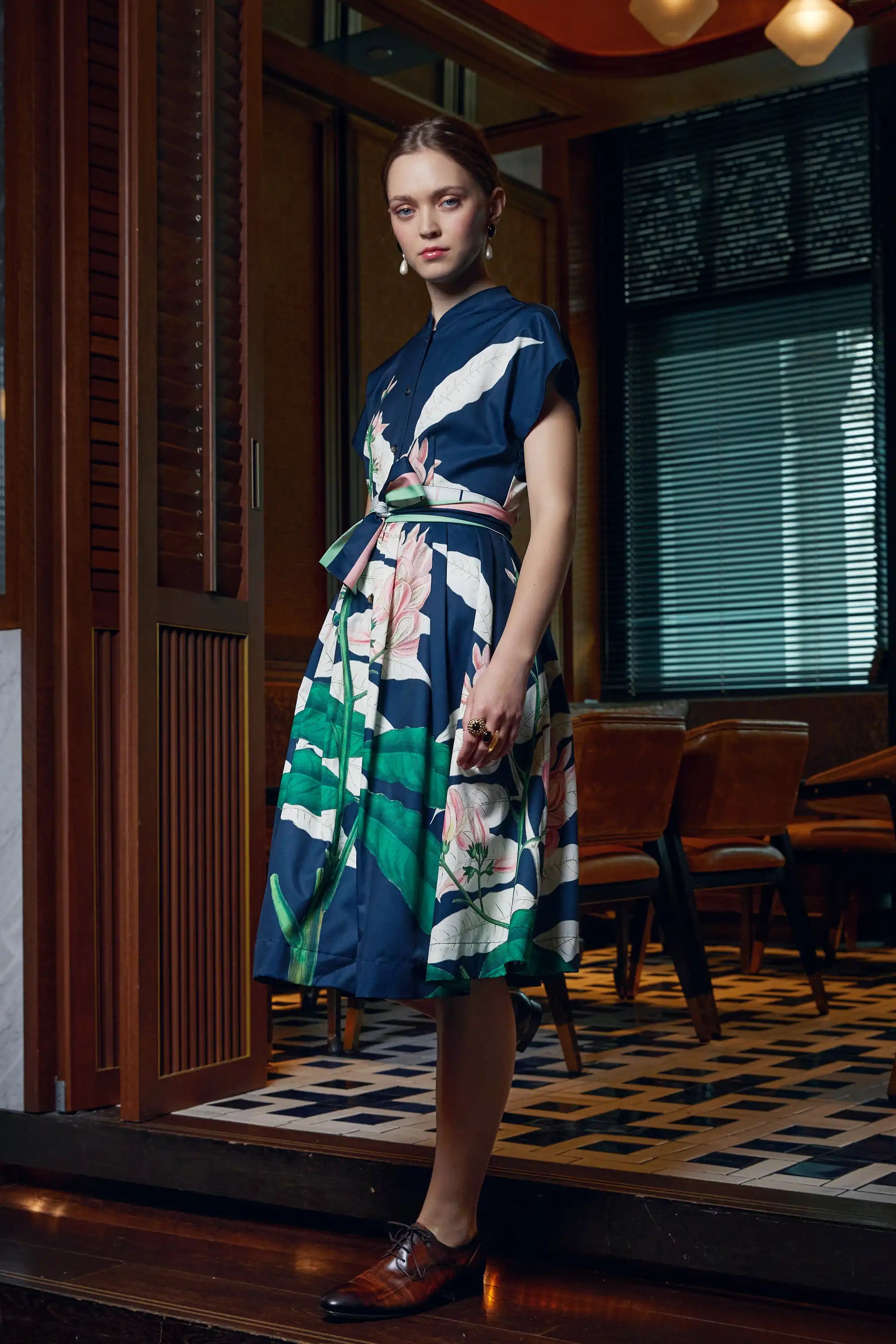Woman wearing Arrayed navy Geoffroya Inermis print midi dress, side view