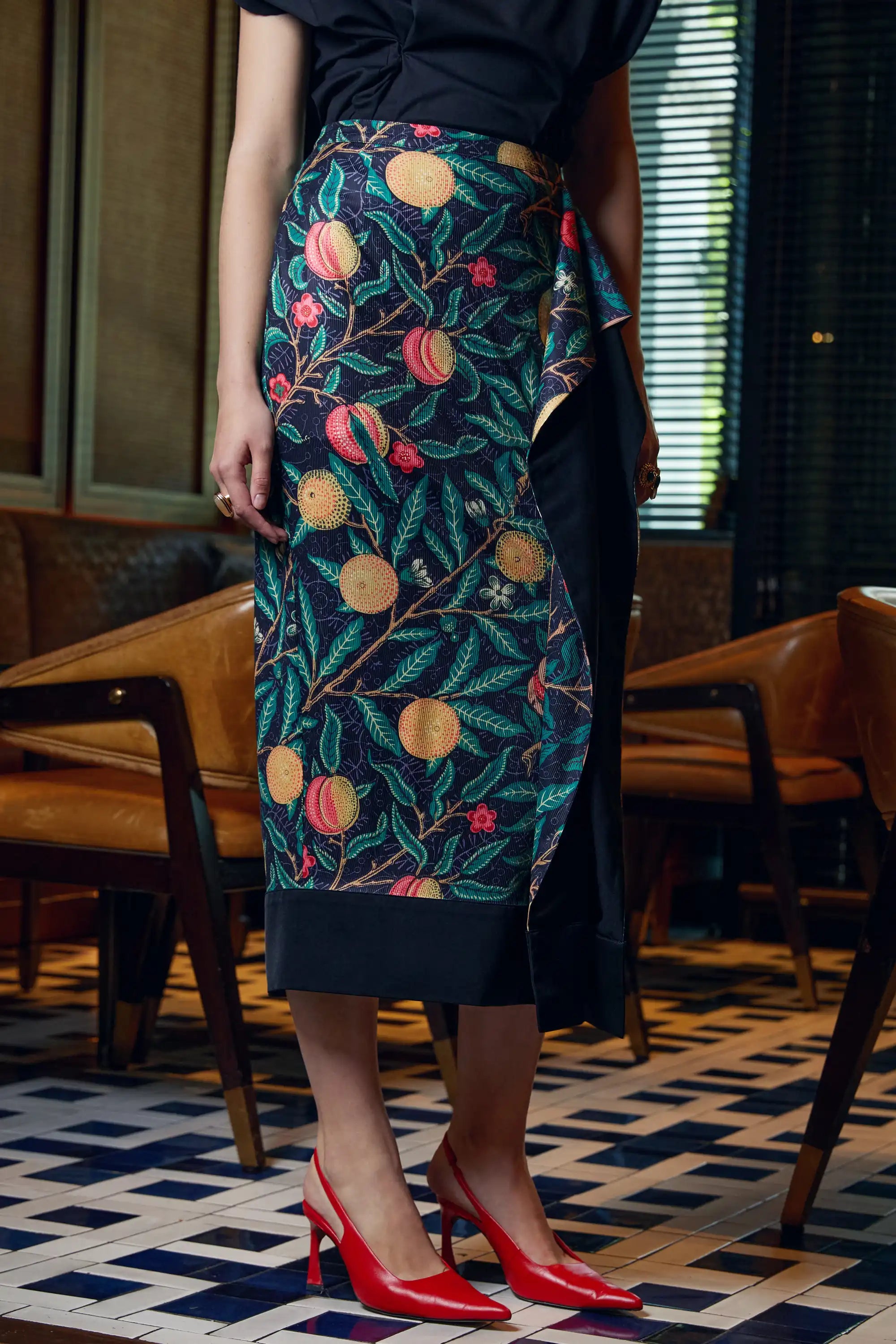 Arrayed black Pomegranate print ribbed midi skirt with draped side panel