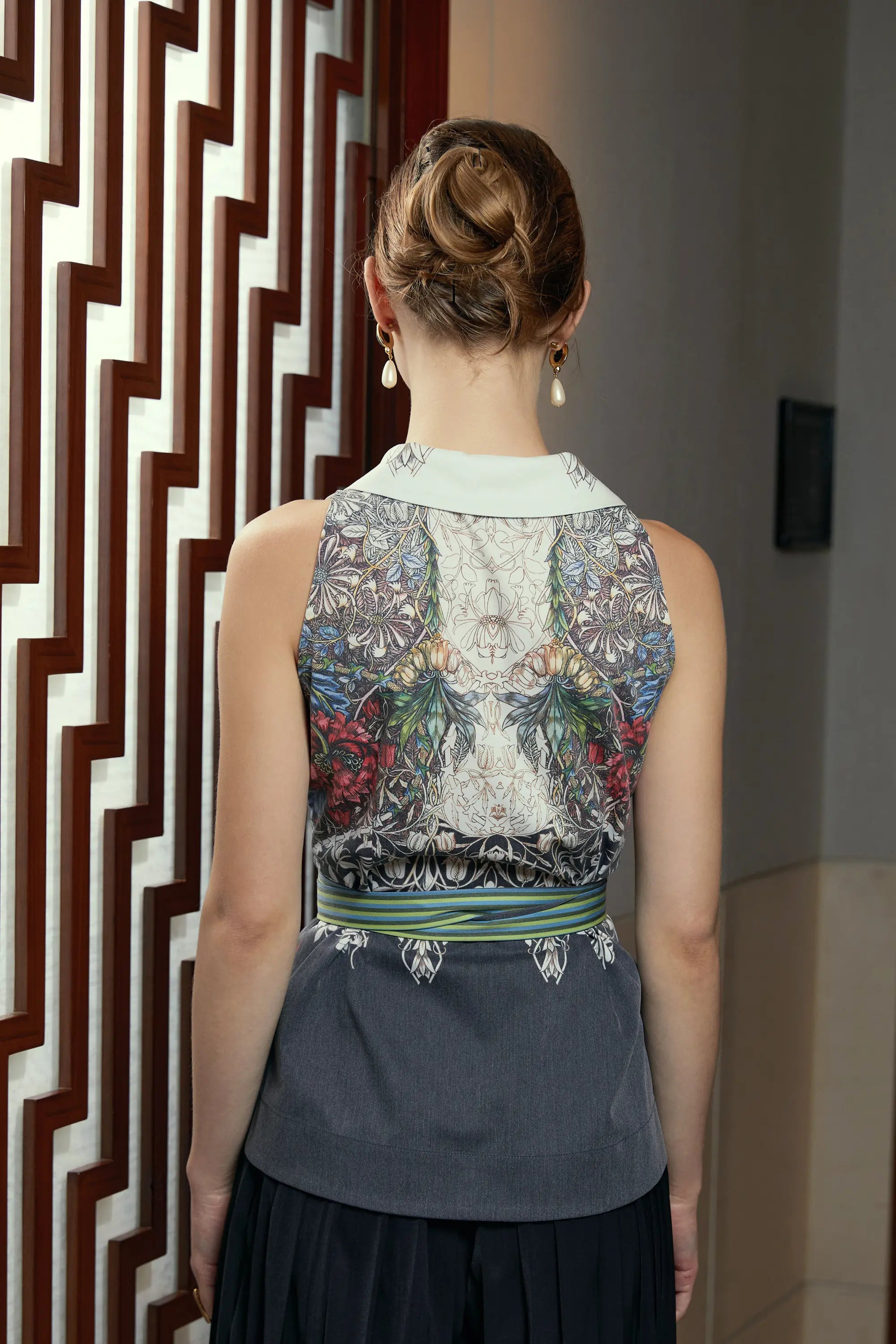 Woman wearing Arrayed Honeysuckle shawl collar top with racer back, back view