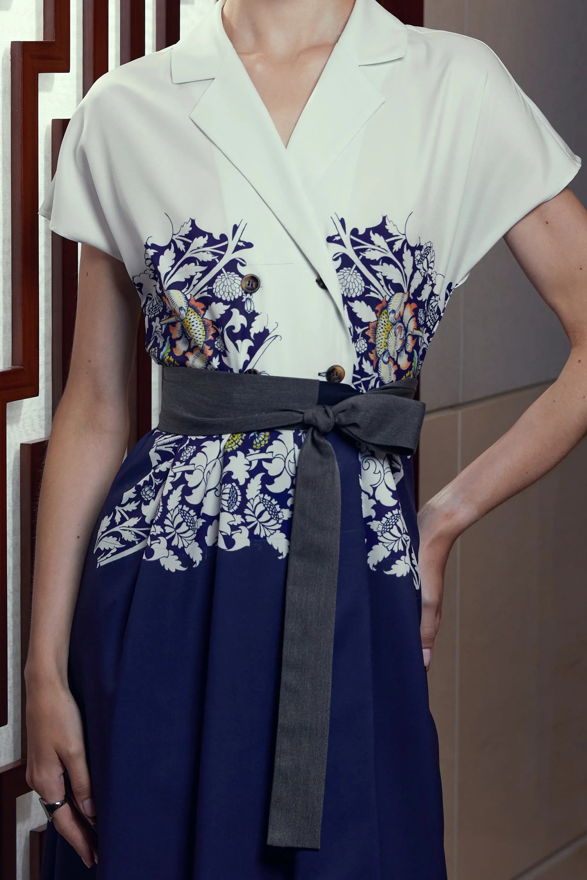 Arrayed Peony floral print detail on ivory trench dress