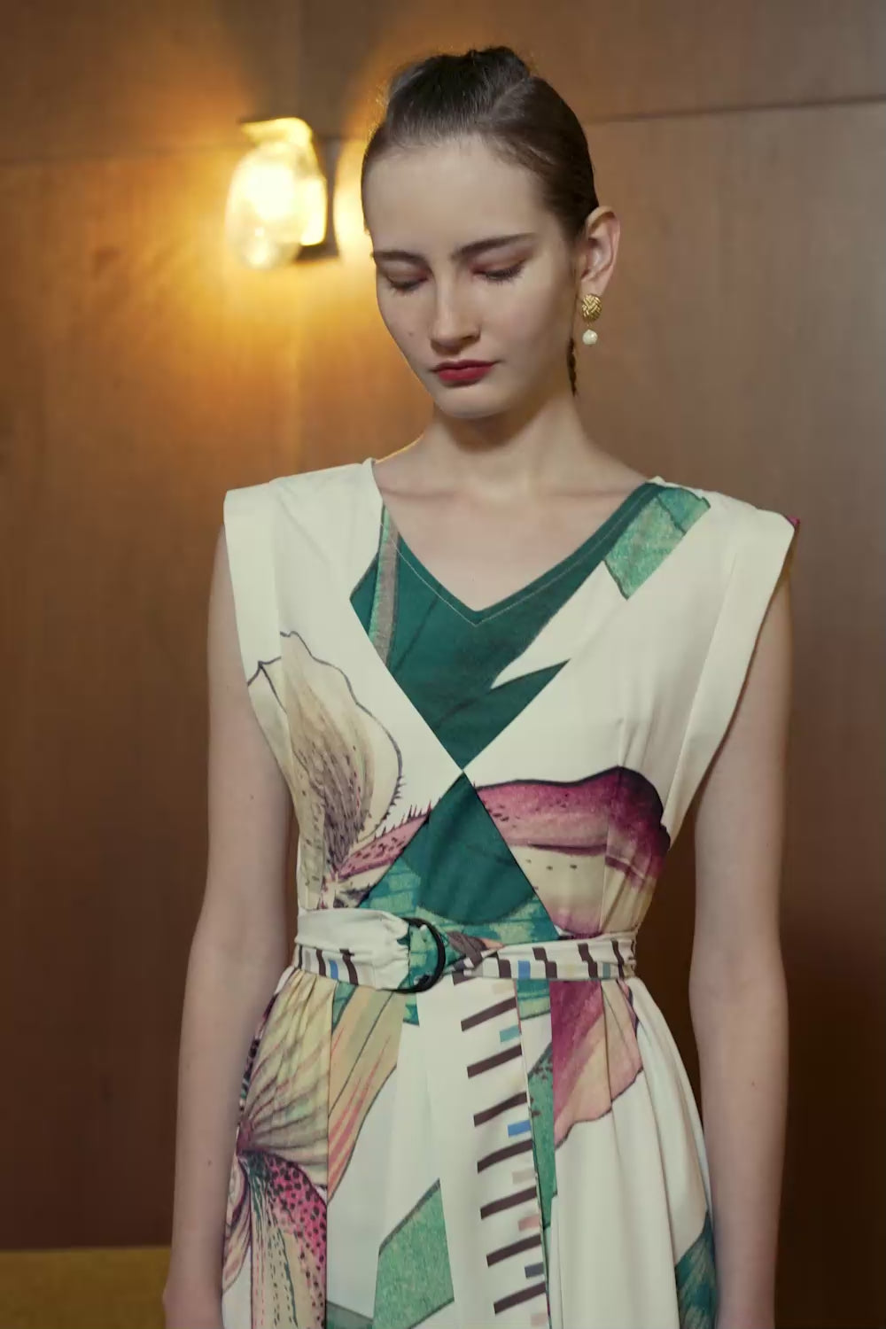Model in Origami Square Sleeve Dress with Paphiopedilum Orchid print — fluid movement and sculpted silhouette in motion